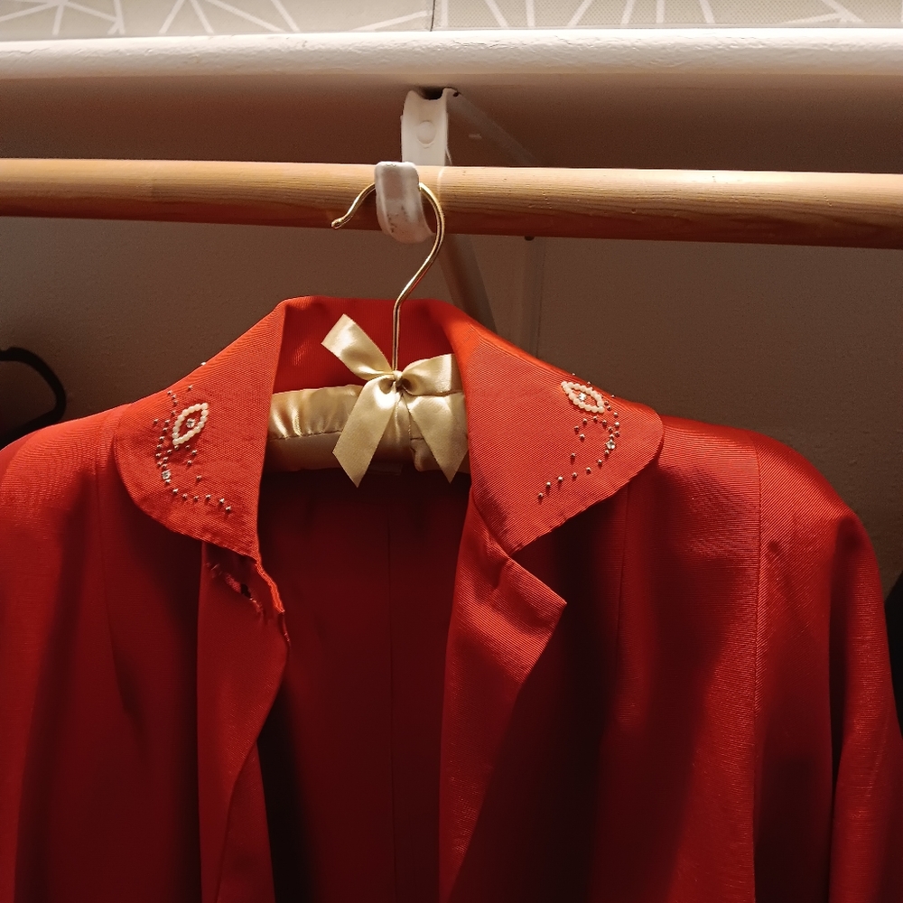 Red vintage swing jacket with beaded design on collar